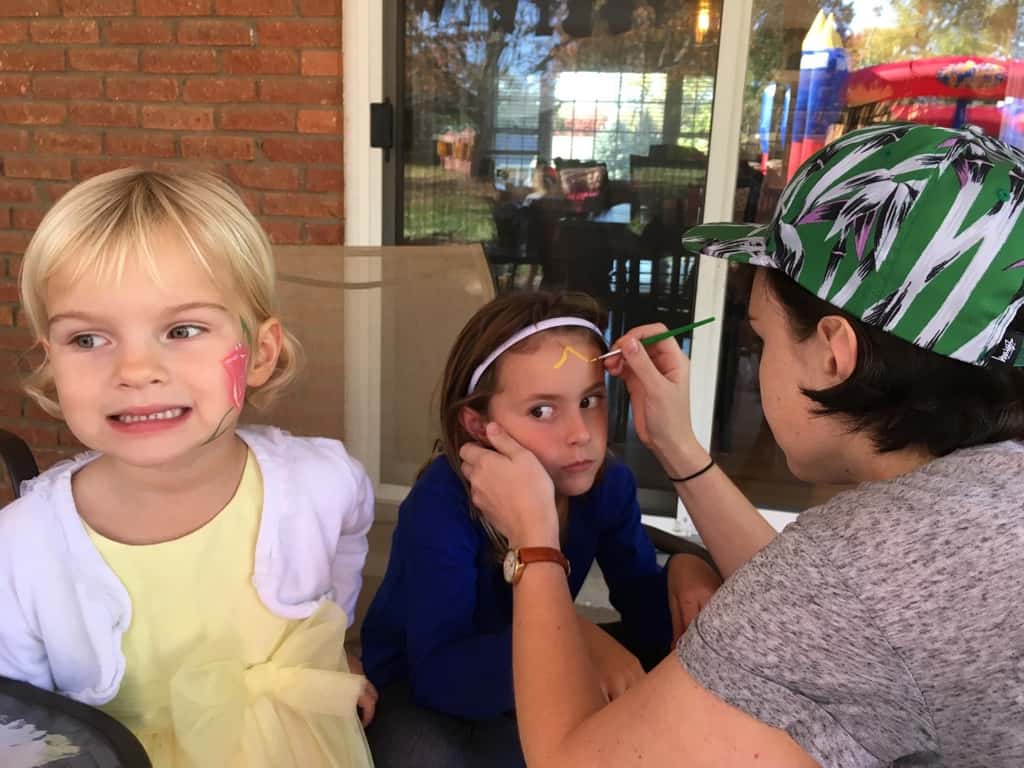 Take lots of bouncing friends, brush on some face paint, press on some tattoos, mix in a craft, eat lots of cupcakes and ice cream, and you end up with two very happy birthday girls!