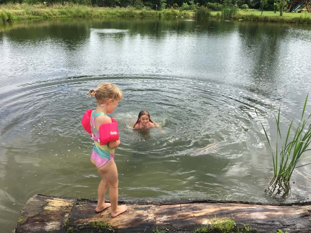 The girls swam in water other than a swimming pool for the first time today at Stella and Ruby’s house, and they loved it! Gwen was unsure of the muddy bottom, but she did finally jump in with everyone else. Josie freaked out when the dogs or goats got too close, but didn’t blink an eye at swimming with frogs and turtles. Abby is part farm girl. She loved everything!
