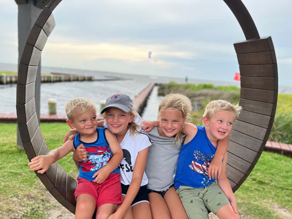 What an amazing trip to the OBX! We stayed in Salvo, one of the villages in the Cape Hatteras National Seashore. We all agreed we couldn’t have picked a better spot. The natural beauty of this place was incredible. I was amazed by the stretches of road where you could experience both the ocean and the sound at once. The waves were intense and the rip tides were terrifying, but beach walks were so nice. We loved collecting shells, hunting ghost crabs, watching the sun rise and set, splashing in the pool, watching Daisy swim, and our many excursions. Tailgating on the vehicle ferry boat ride to Ocracoke was fun. We also enjoyed jet skiing and a dolphin boat cruise from Wanchese. Watching the kite boarders while enjoying dinner at Waterman’s was a fun experience too.